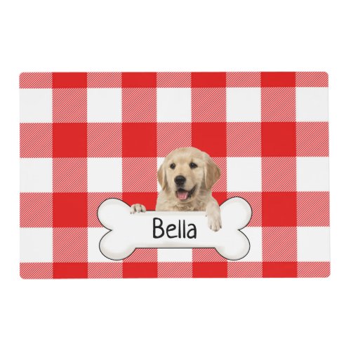 golden retriever with bone on red plaid placemat