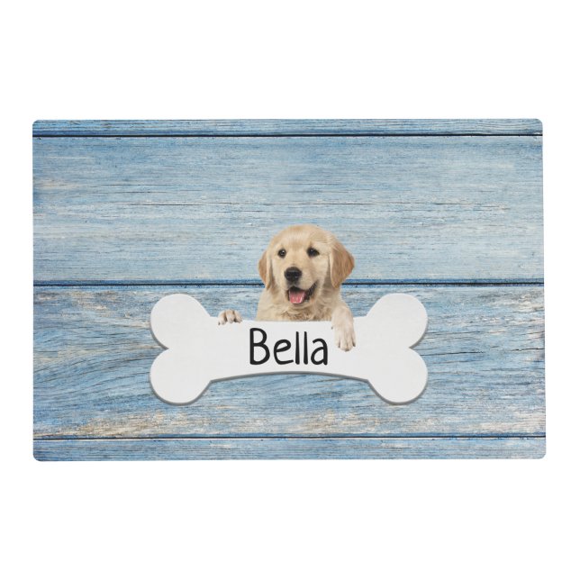 Golden retriever with bone on wood placemat (Front)