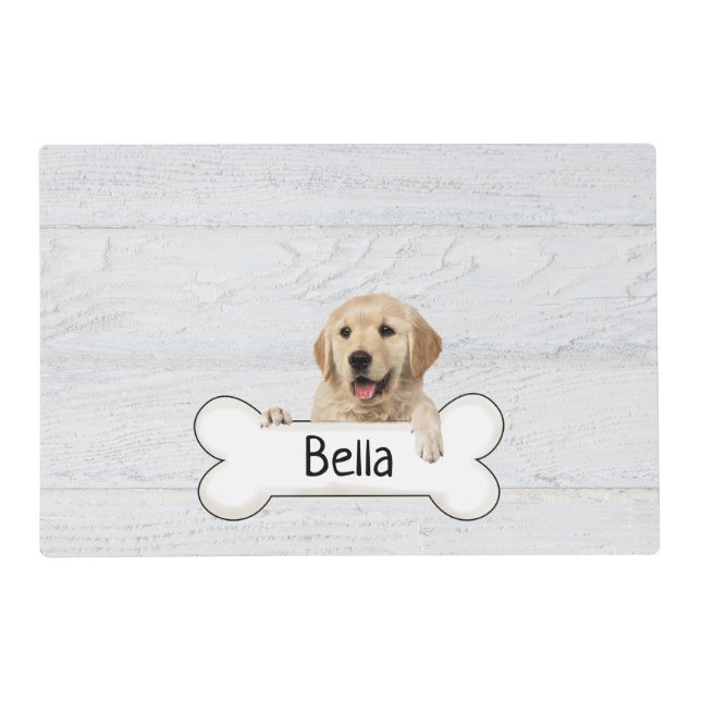Golden retriever with bone on wood placemat (Front)