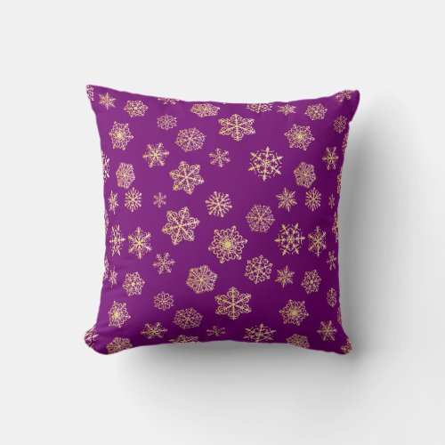 Golden snowflakes on a purple background throw pillow