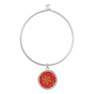 Golden snowflakes on red bangle bracelet