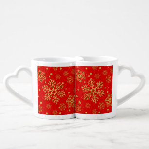 Golden snowflakes on red coffee mug set