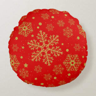 Golden snowflakes on red round pillow