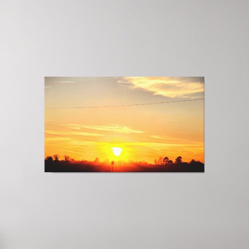 Golden Sunset Over Silhouetted Trees Canvas Print