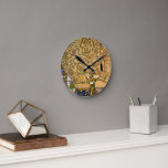 Golden Swirling Tree of Life Art Deco Symbolic  Round Clock<br><div class="desc">Bring a touch of timeless symbolism and artistic brilliance to your space with this Gustav Klimt’s The Tree of Life piece, on a modern clock. This celebrated masterpiece is renowned for its swirling, golden branches that twist and spiral across a luminous backdrop, creating a mesmerizing tapestry of color and pattern....</div>