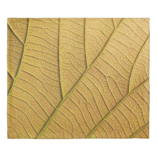 Golden yellow leaf pattern in the morning.  duvet cover