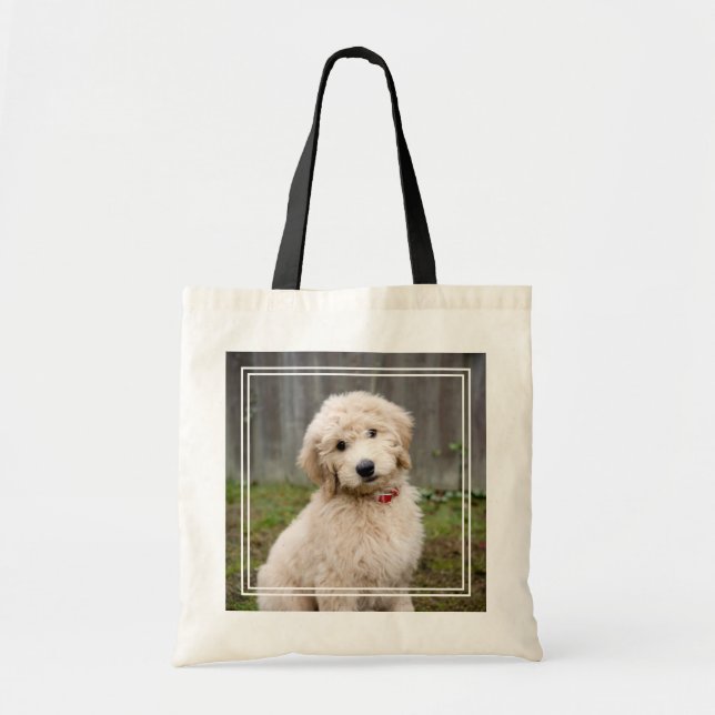 Goldendoodle Puppy Sits In Grass Tote Bag (Front)