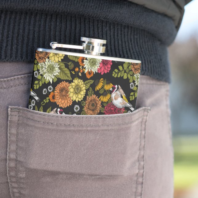 Goldfinches in the garden on black flask (In Situ)