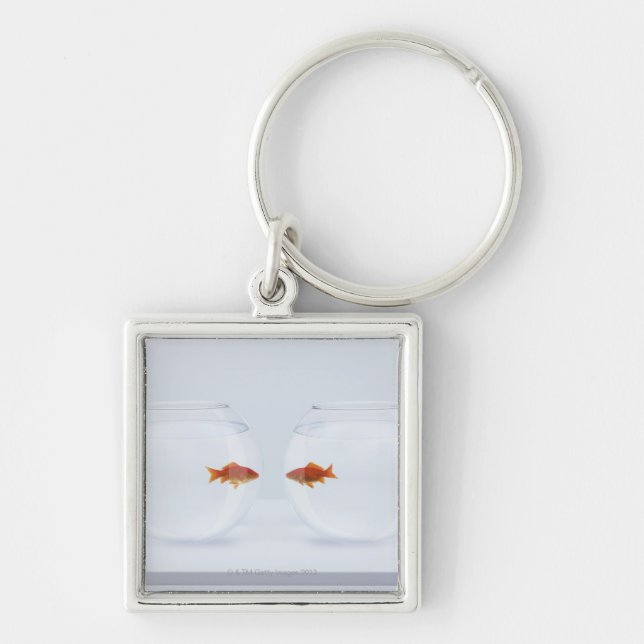 Goldfish in separate fishbowls looking face to fac keychain (Front)