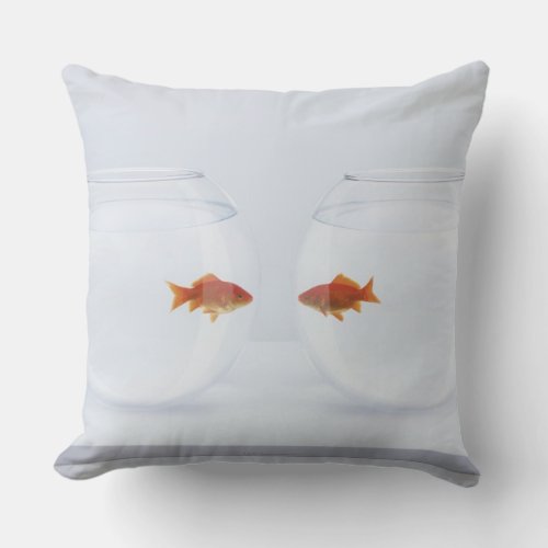 Goldfish in separate fishbowls looking face to fac throw pillow
