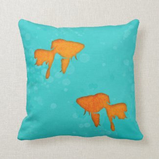 Goldfish orange silhouettes in turquoise water