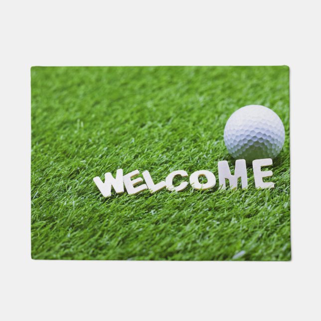 Golf ball aand welcome woed on grass doormat (Front)