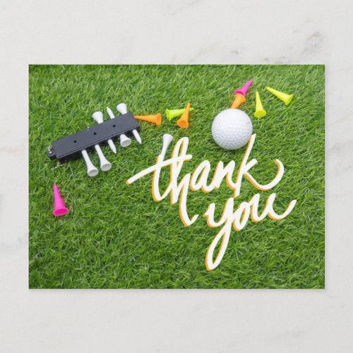 Golf ball and colorful tee  green grass thank you postcard