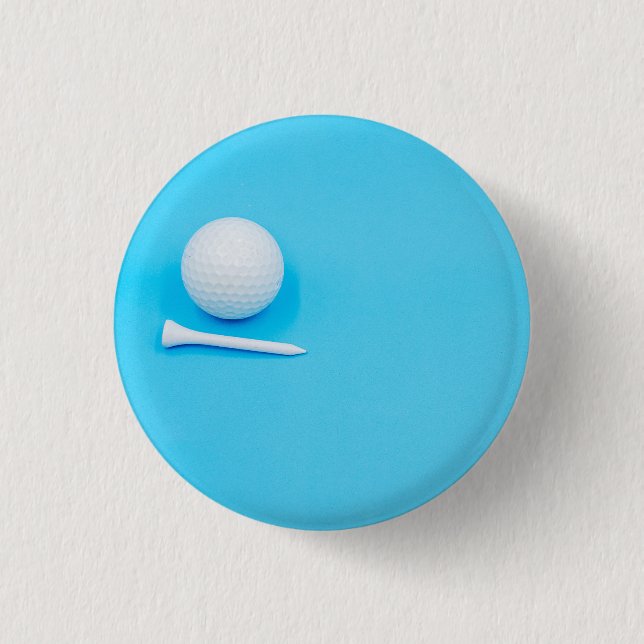 Golf ball and tee are on blue background button (Front)