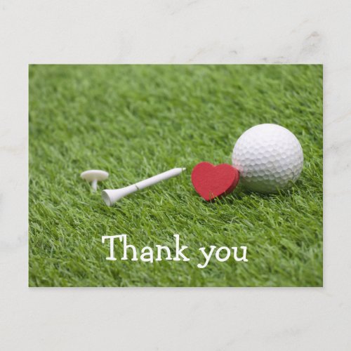 Golf ball and tee are on green with love postcard