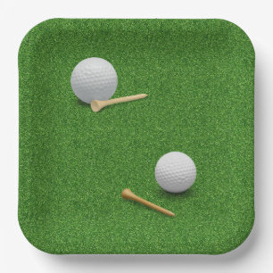 Golf ball and tee on green grass background paper plates
