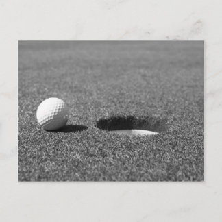 Golf Ball beside hole Postcard