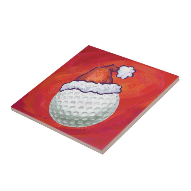 Golf Ball in Santa Hat on Red Ceramic Tile (Side)