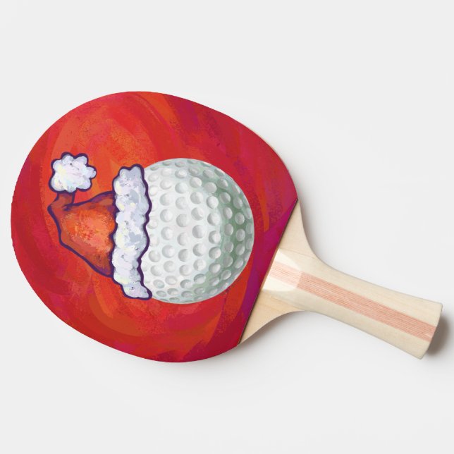 Golf Ball in Santa Hat on Red Ping-Pong Paddle (Side)