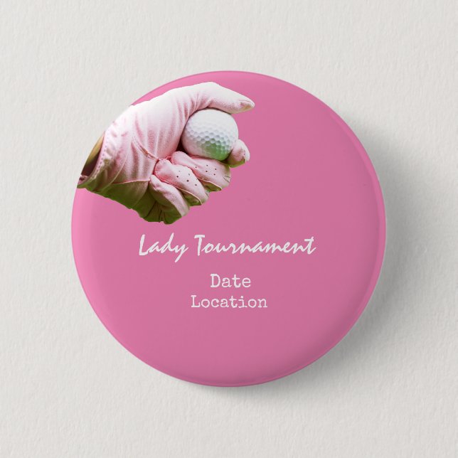 Golf ball is in lady golfer's hand on pink button (Front)