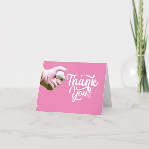 Golf ball is in lady golfer's hand on pink letterpress thank you card