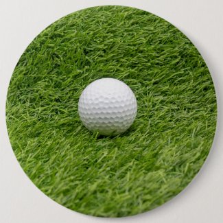 Golf ball is on green grass golf ball marker button