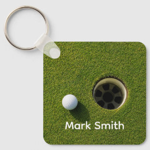 Golf Ball Next to Hole on Green Grass Golf Course Keychain