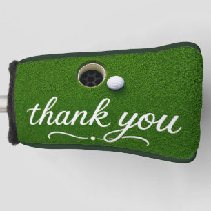 Golf ball next to hole with text thank you head cover