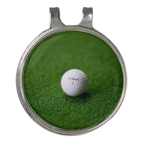 Golf ball on a green surface Golf Hat Clip 