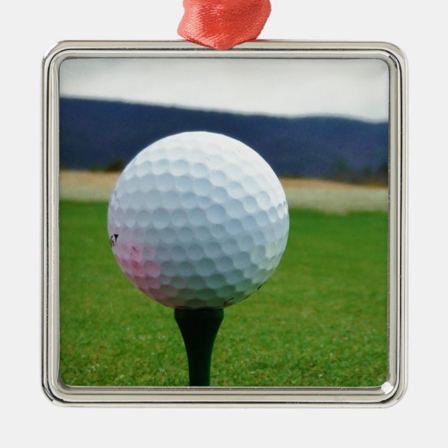 Golf Ball on a mountain golf course Metal Ornament (Front)