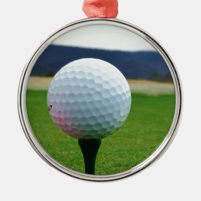 Golf Ball on a mountain golf course Metal Ornament (Front)