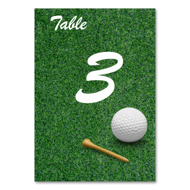 Golf ball on green grass for golfer party  table number (Front)