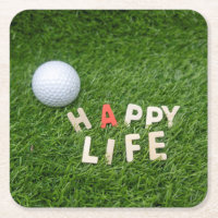 Golf ball on green grass happy life happy golfer square paper coaster