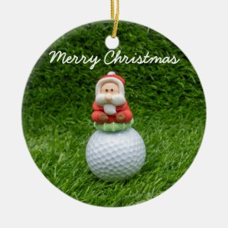 Golf ball Santa Claus is on green grass Christmas Ceramic Ornament