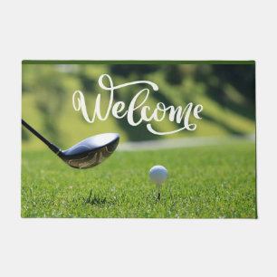 Golf ball tee off on green welcome golfer doormat