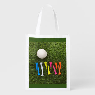 Golf ball with colourful tees are on green grocery bag