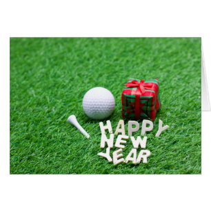 Golf Ball with Happy New Year on Green Grass Cards