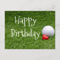 Golf ball with heart are on green grass postcard