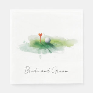 Golf ball with red heart tee on green grass napkins