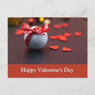 Golf ball with red ribbon with love red hearts postcard
