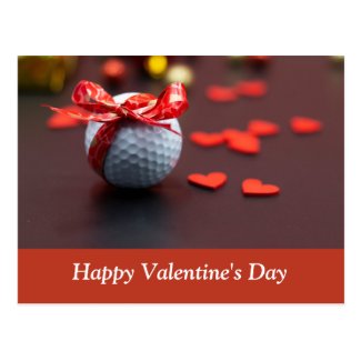 Golf ball with red ribbon with love red hearts postcard