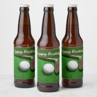 Golf ball with sand wedge on green grass beer bottle label
