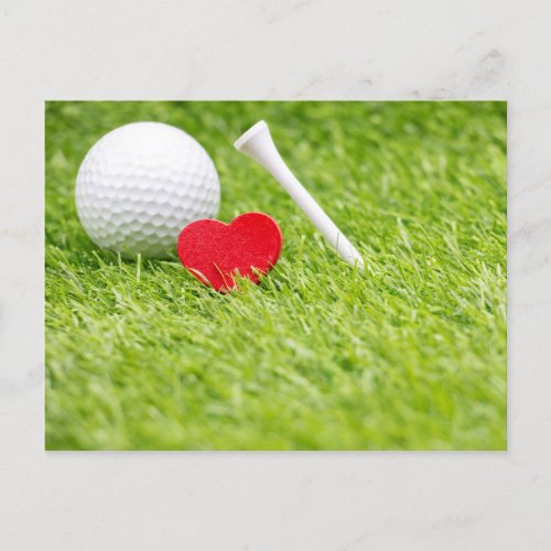 Golf ball with tee and red heart on green grass announcement postcard