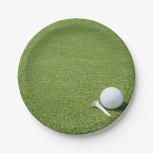 Golf ball with tee on green grass golfer party paper plates