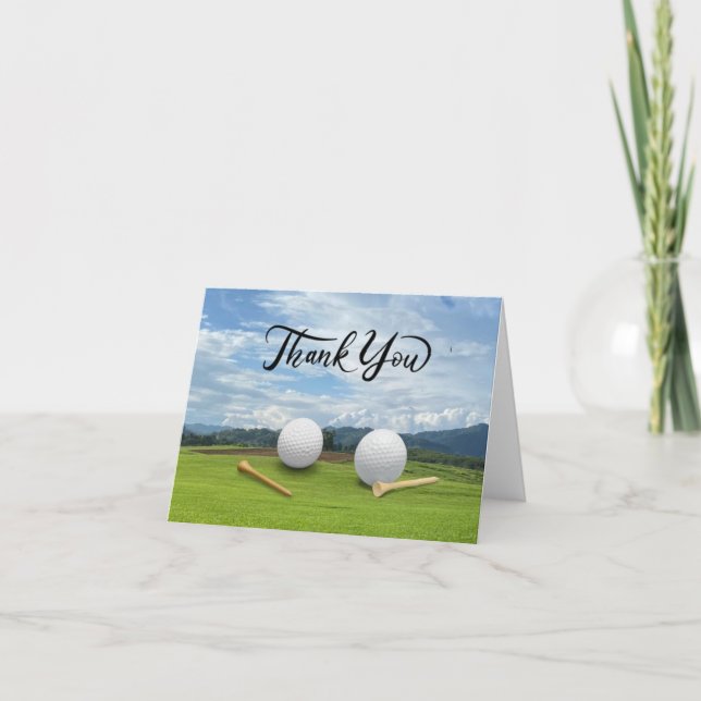 Golf  ball with tee on green grass thank you card (Front)