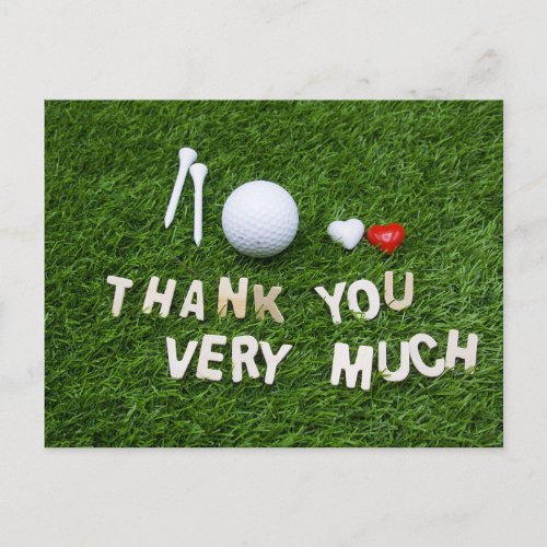 Golf ball with thank you on green grass golfer postcard