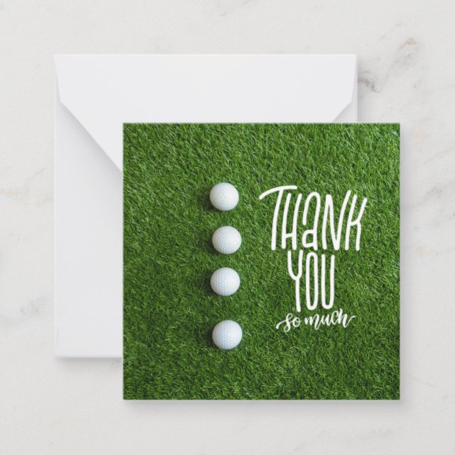 Golf ball with thank you so much on green grass note card (Front)