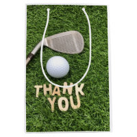 Golf ball with thank you word on green grass medium gift bag