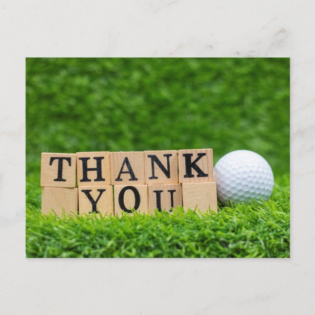 Golf ball with thank you word on green grass  postcard (Front)