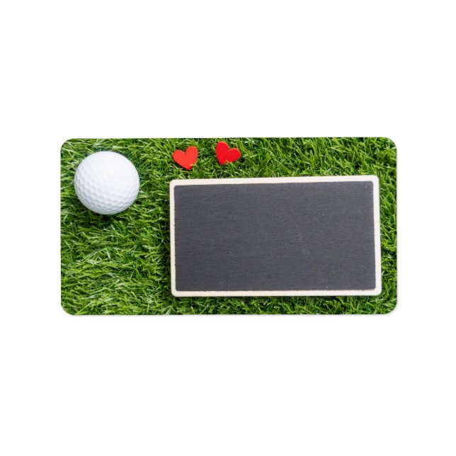 Golf ball with two hearts are on green with board label (Front)